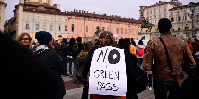 People gather and stage a No Green Pass protest in Turin, Italy on Friday. 