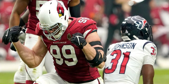 Arizona Cardinals defensive end J.J. Watt celebrates after a tackle against the Houston Texans during the first half of an NFL football game, Sunday, Oct. 24, 2021, in Glendale, Arizona.