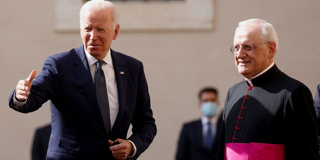 Monsignor Leonardo Sapienza receives U.S. President Joe Biden as he arrives at the Vatican to meet Pope Francis, October 29, 2021.