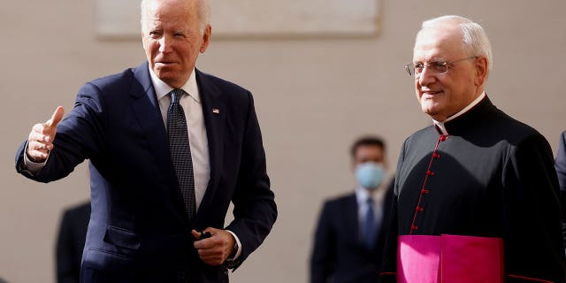 Monsignor Leonardo Sapienza receives U.S. President Joe Biden as he arrives at the Vatican to meet Pope Francis, October 29, 2021.