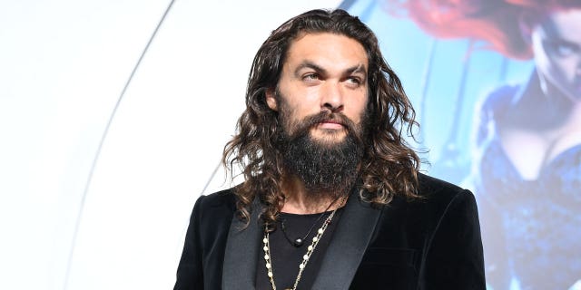 Jason Momoa arrives at the premiere of Warner Bros. Pictures' 