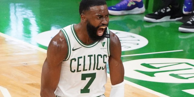 ,Boston Celtics guard Jaylen Brown reacts after his three-point basket against the San Antonio Spurs in the third quarter April 30, 2021, at TD Garden in Boston, Massachusetts.