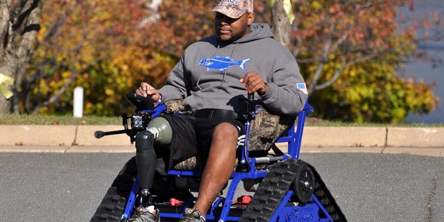 Veteran Jeramie Green with a customized all-terrain wheelchair from Freedom Alliance. 
