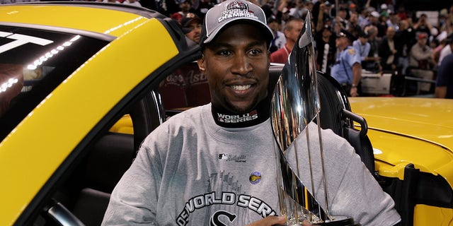 Jermaine Dye #23 of the Chicago White Sox celebrates with the World Series MVP Trophy after winning Game 4 of the 2005 Major League Baseball World Series against the Houston Astros at Minute Maid Park on Oct. 26, 2005, in Houston, Texas. 