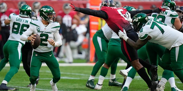 New York Jets quarterback Zach Wilson (2) takes the ball during an NFL football game between the New York Jets and the Atlanta Falcons at Tottenham Hotspur Stadium in London, England, on Sunday 10 October 2021.