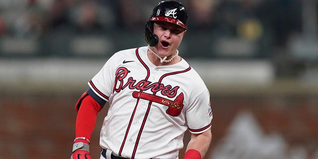 Atlanta Braves' Joc Pederson celebrates after hitting a two-run home run during the fourth inning in Game 2 of baseball's National League Championship Series against the Los Angeles Dodgers Sunday, Oct. 17, 2021, in Atlanta.