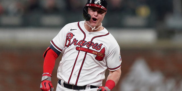 Atlanta Braves' Joc Pederson celebrates after hitting a two-run home run during the fourth inning in Game 2 of baseball's National League Championship Series against the Los Angeles Dodgers Sunday, Oct. 17, 2021, in Atlanta.