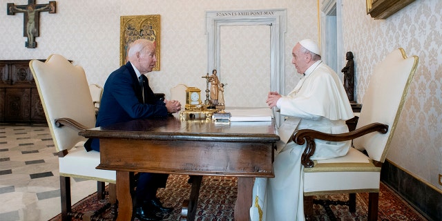 US President Joe Biden, left, speaks with Pope Francis during their meeting at the Vatican on Friday, October 29, 2021 (Vatican Media via AP)