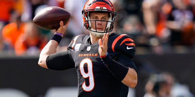 Cincinnati Bengals quarterback Joe Burrow (9) throws against the Green Bay Packers in the first half of an NFL football game in Cincinnati, Sunday, Oct. 10, 2021.