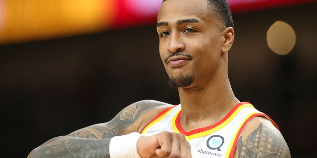 Atlanta Hawks forward John Collins shows emotion on the court against the Miami Heat in the first half Oct. 14, 2021, at State Farm Arena in Atlanta, Georgia.