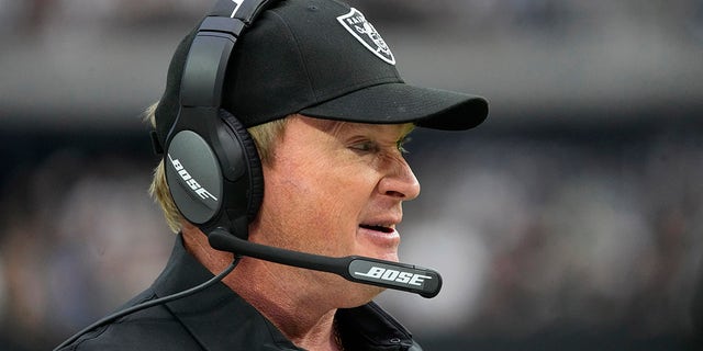 Las Vegas Raiders head coach Jon Gruden stands on the sidelines during the first half of an NFL football game against the Miami Dolphins on Sunday, September 26, 2021, in Las Vegas.