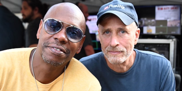 Jon Stewart, right, defended Dave Chappelle after many demanded the actor's cancellation following his remarks on the Netfliix stand-up special,