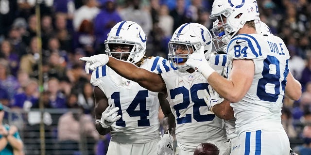 Indianapolis Colts running back Jonathan Taylor (28) celebrates his touchdown with his teammates during the second half of an NFL football game against the Baltimore Ravens, Monday, Oct. 11, 2021, in Baltimore.