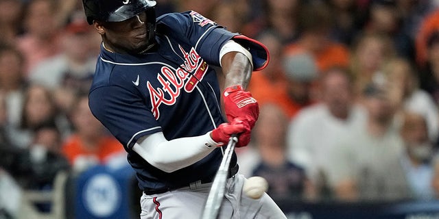 Atlanta Braves' Jorge Soler hits a home run during the first inning of Game 1 in baseball's World Series between the Houston Astros and the Atlanta Braves Tuesday, Oct. 26, 2021, in Houston.
