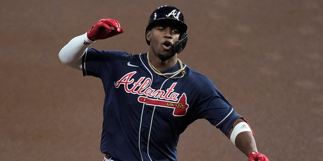 Atlanta Braves' Jorge Soler celebrates his home run during the first inning of Game 1 in baseball's World Series between the Houston Astros and the Atlanta Braves Tuesday, Oct. 26, 2021, in Houston.