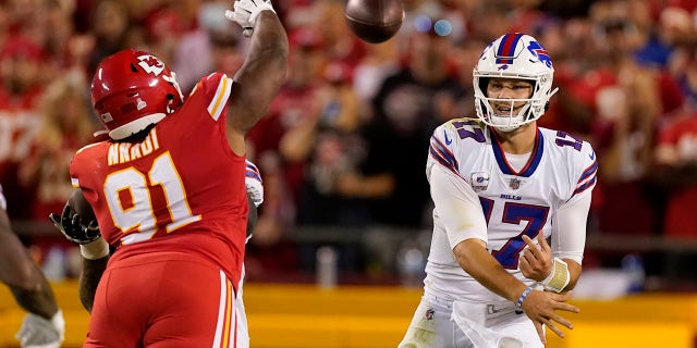 Buffalo Bills quarterback Josh Allen (17) throws over Kansas City Chiefs defensive tackle Derrick Nnadi (91) during the first half of an NFL football game Sunday, Oct. 10, 2021, in Kansas City, Mo.
