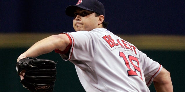Starting pitcher Josh Beckett of the Boston Red Sox delivers a pitch against the Tampa Bay Rays in game six of the American League Championship Series during the 2008 MLB playoffs on Oct. 18, 2008, at Tropicana Field in St Petersburg, Florida.