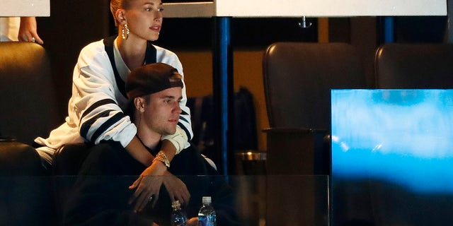 Justin Bieber and wife, Hailey Rhode Bieber, watch Game Seven of the Eastern Conference First Round during the 2019 NHL Stanley Cup Playoffs between the Boston Bruins and the Toronto Maple Leafs at TD Garden on April 23, 2019, in Boston, Massachusetts.