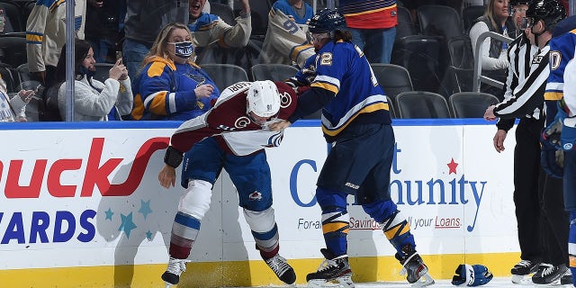 Justin Faulk (72) of the St. Louis Blues gets physical with Nazem Kadri of the Colorado Avalanche at the Enterprise Center on Oct. 28, 2021, in St. Louis, Missouri.