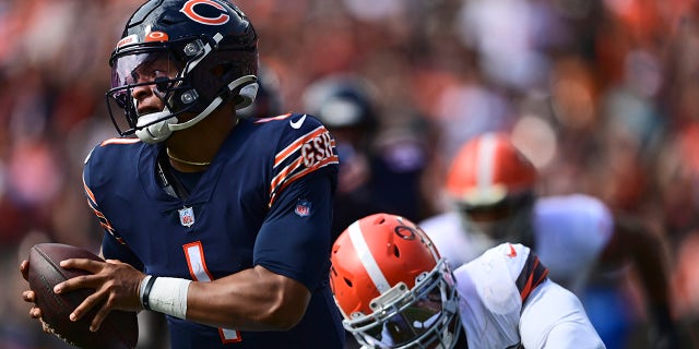 Cleveland Browns defensive end Myles Garrett, right, sacks Chicago Bears quarterback Justin Fields during the second half of an NFL football game, Sunday, Sept. 26, 2021, in Cleveland.