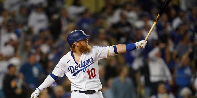 The Los Angeles Dodgers' Justin Turner reacts after hitting a solo home game during the fourth innings of a baseball game in the National League Wild Card playoff game against the St.  Louis Cardinals, Wednesday, October 6, 2021 in Los Angeles.