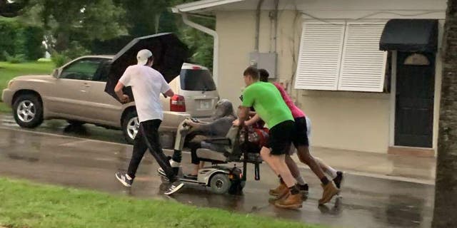 Four young men stepped up to help a woman after her scooter broke down in the middle of a street in Seminole County, Florida.