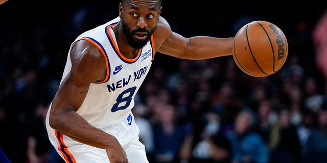 New York Knicks' Kemba Walker (8) drives toward the basket during the second half of an NBA basketball game against the Philadelphia 76ers Tuesday, Oct. 26, 2021, in New York. The Knicks won 112-99.