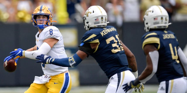 Pittsburgh quarterback Kenny Pickett (8) works against Georgia Tech during the first half of an NCAA college football game, Saturday, Oct. 2, 2021, in Atlanta. 