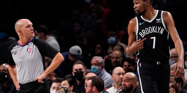 Brooklyn Nets forward Kevin Durant (7) argues with referee Jacyn Goble, left, during the second half of an NBA basketball game, Wednesday, Oct. 27, 2021, in New York.