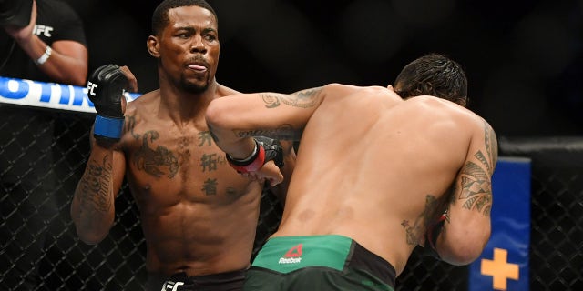 Kevin Holland (blue gloves) fights Anthony Hernandez (red gloves) during UFC on ESPN at VyStar Veterans Memorial Arena.