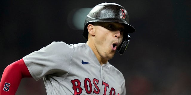 Boston Red Sox's Enrique Hernandez celebrates after a home run against the Houston Astros during the third inning in Game 1 of baseball's American League Championship Series Friday, Oct. 15, 2021, in Houston.