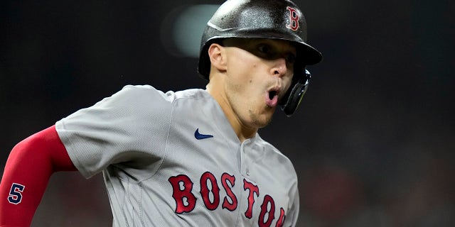 Boston Red Sox's Enrique Hernandez celebrates after a home run against the Houston Astros during the third inning in Game 1 of baseball's American League Championship Series Friday, Oct. 15, 2021, in Houston.