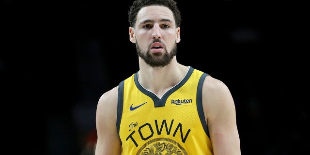 Klay Thompson of the Golden State Warriors reacts against the Portland Trail Blazers in the third quarter during their game at Moda Center on Feb. 13, 2019, in Portland, Oregon.
