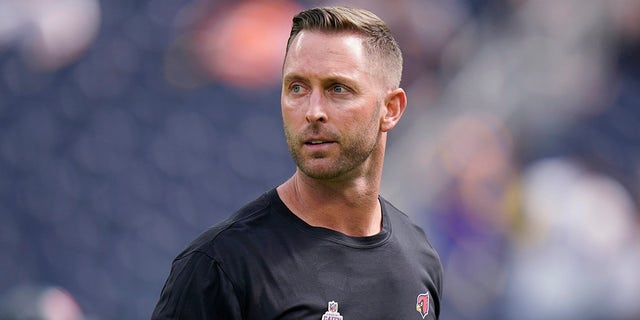 FILE - In this Oct. 3, 2021, file photo, Arizona Cardinals coach Kliff Kingsbury walks on the field before the team's NFL football game against the Los Angeles Rams in Inglewood, Calif.