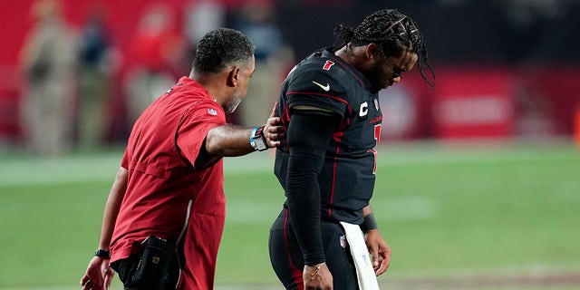 Arizona Cardinals quarterback Kyler Murray walks off the field after being hit during the second half of an NFL football game against the Green Bay Packers, Thursday, Oct. 28, 2021, in Glendale, Arizona. The Packers won 24-21.