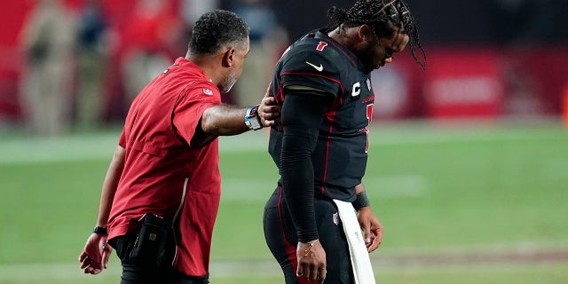 Arizona Cardinals quarterback Kyler Murray walks off the field after being hit during the second half of an NFL football game against the Green Bay Packers, Thursday, Oct. 28, 2021, in Glendale, Arizona. The Packers won 24-21.