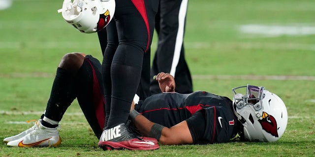 Arizona Cardinals quarterback Kyler Murray lies on the field after being hit during the second half of an NFL football game against the Green Bay Packers, Thursday, Oct. 28, 2021, in Glendale, Ariz. The Packers won 24-21.