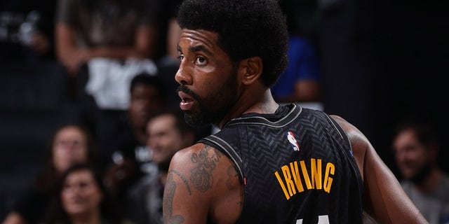 Kyrie Irving of the Brooklyn Nets looks on during the game against the Boston Celtics during Round 1, Game 5 of the 2021 NBA Playoffs on June 1, 2021, at Barclays Center in Brooklyn, New York. 