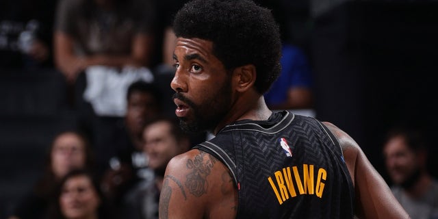 Kyrie Irving #11 of the Brooklyn Nets looks on during the game against the Boston Celtics during Round 1, Game 5 of the 2021 NBA Playoffs on June 1, 2021 at Barclays Center in Brooklyn, New York.