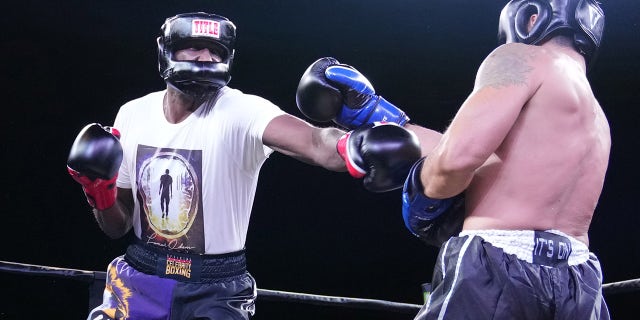 Lamar Odom punches Ojani Noa during the second round of the Celebrity Boxing Miami 2021 Lamar Odom vs Ojani Noa at the James L. Knight Center on October 02, 2021 in Miami, Florida.
