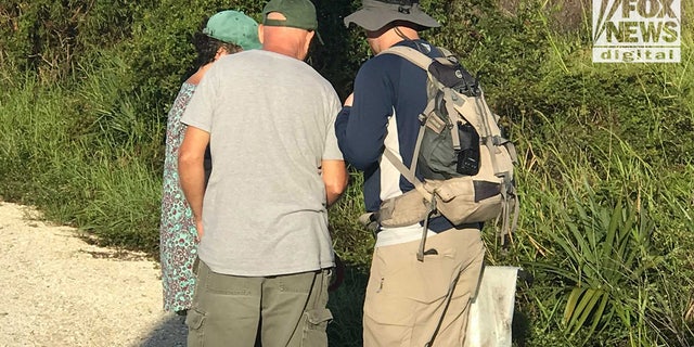 Images obtained exclusively by Fox News show Chris and Roberta Laundrie in the  Myakkahatchee Creek Environmental Park with at least one law enforcement officer on Wednesday