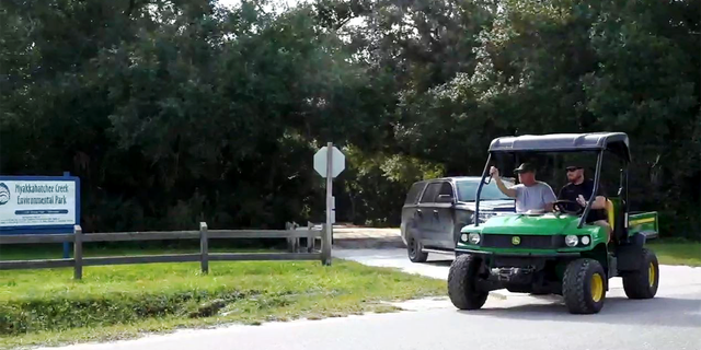 Chris Laundrie joins Brian Laundrie's research at Myakkahatchee Creek Environmental Park on October 7, 2021.