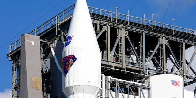 The Lucy spacecraft sits atop a United Launch Alliance Atlas V rocket ready for launch at Launch Complex 41 at the Cape Canaveral Space Force Station, Friday, Oct. 15, 2021, in Cape Canaveral, Fla.  Lucy, scheduled to launch Saturday at 5:34am will observe Trojan asteroids, a unique family of asteroids that orbit the sun in front of and behind Jupiter. 