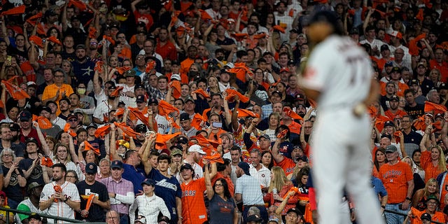 Fans cheer as Houston Astros starting pitcher Luis Garcia throws against the Boston Red Sox during the sixth inning in Game 6 of baseball's American League Championship Series Friday, Oct. 22, 2021, in Houston.