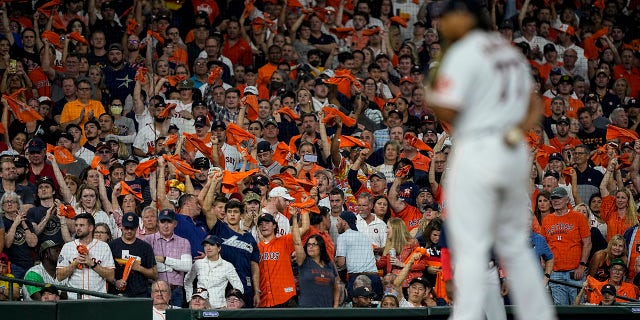 Fans cheer as Houston Astros starting pitcher Luis Garcia throws against the Boston Red Sox during the sixth inning in Game 6 of baseball's American League Championship Series Friday, Oct. 22, 2021, in Houston.