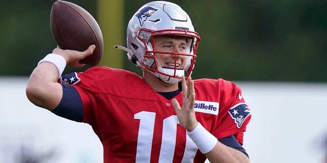 New England Patriots quarterback Mac Jones winds up for a pass during an NFL football practice, Wednesday, Sept. 29, 2021, in Foxborough, Massachusetts.