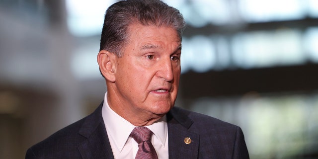 Sen. Joe Manchin, D-W.Va., speaks to reporters outside of his office on Capitol Hill on October 6, 2021, in Washington, D.C. (Photo by Kevin Dietsch/Getty Images)