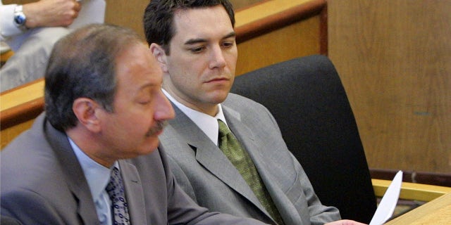Scott Peterson sits in the courtroom at the San Mateo Superior Courthouse with his attorney Mark Geragos in 2004. Peterson was found guilty of first degree murder of his wife and second degree murder of their unborn son.