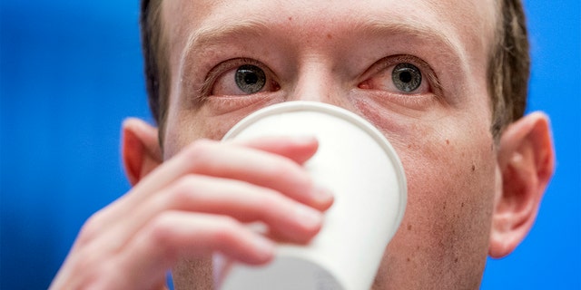 FILE - In this April 11, 2018, file photo, Facebook CEO Mark Zuckerberg takes a drink of water as he testifies before a House Energy and Commerce hearing on Capitol Hill in Washington. (AP Photo/Andrew Harnik, File)