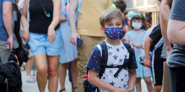 A child wears a face mask on the first day of New York City schools, amid the coronavirus pandemic in Brooklyn, New York, on September 13, 2021.